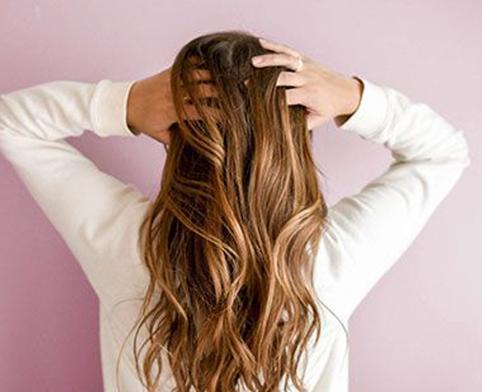 Woman showing off her Hair Highlights in Las Vegas, NV